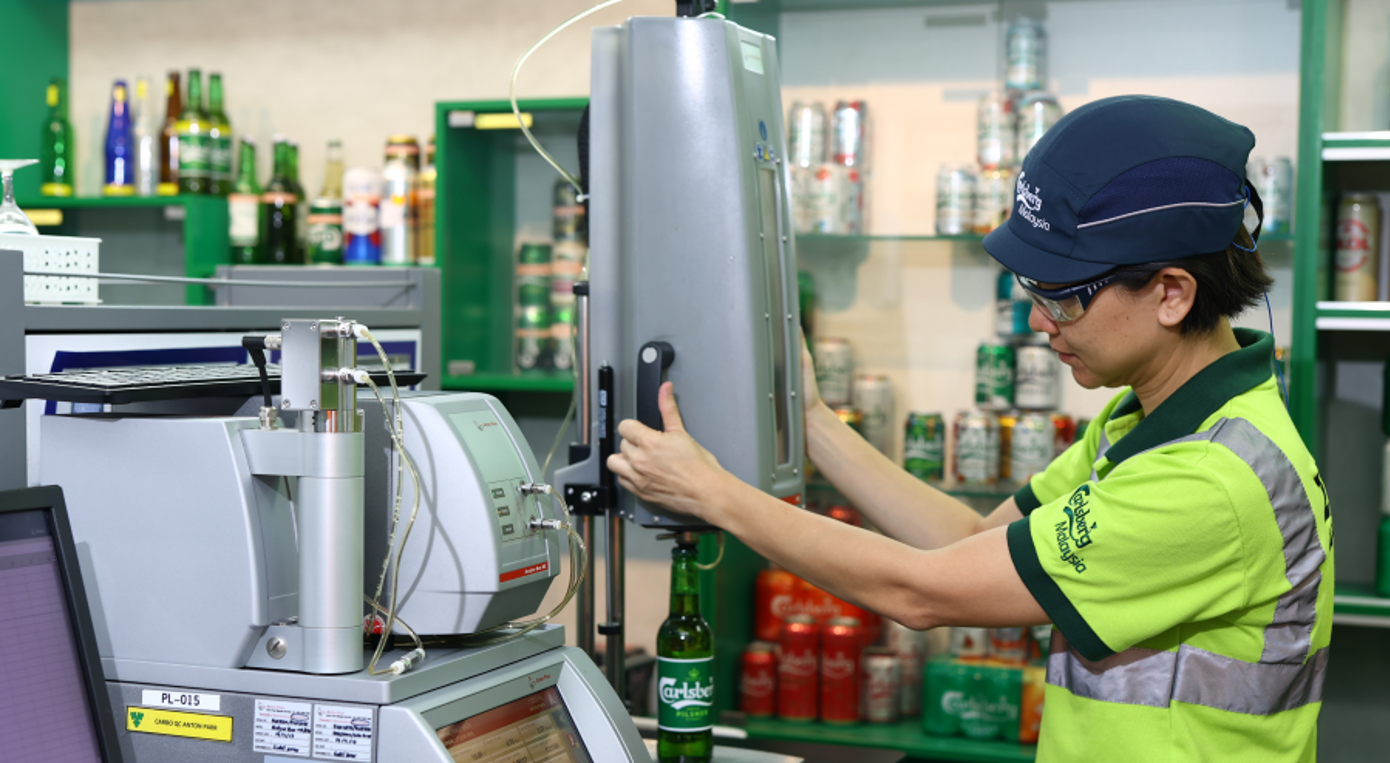 A quality control process being undertaken to test alcohol quality, where testing is conducted on alcohol percentage, CO2 levels, degree of fermentation and °P (Plato gravity scale).